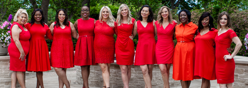 group of women in red dresses